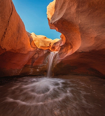 Desert waterfall sculpting sand